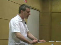 Photograph of Dr Mikel J. Koven making presentation